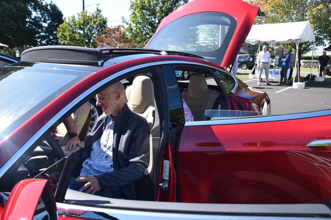 man sitting in electric vehicle